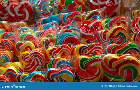 Colorful Swirl Lollipops at Confectionery. Sweet Candy for Kids Party. Candy Day Concept. Spiral ...