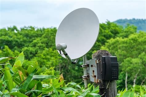 Premium Photo | Public satellite phone for emergency communication among bamboo thickets in the ...