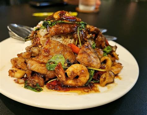 Pad Kra Pao, Thai Food Spicy Stir-Fried Seafood with Basil and Rice ...