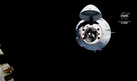 SpaceX's first reused Crew Dragon docks at space station with four Crew ...