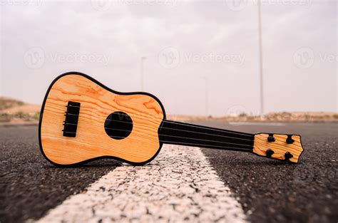 Acoustic guitar on the road 17650979 Stock Photo at Vecteezy