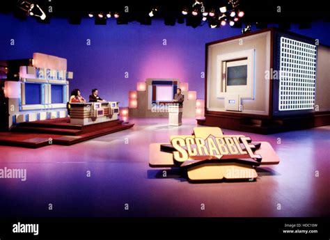 SCRABBLE, (from left): contestants, host Chuck Woolery (right), 1993 ...