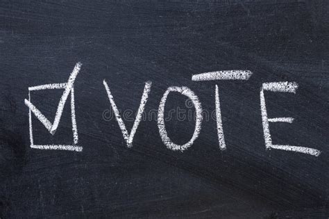 White Vote Lettering Near Check Mark on Black Chalkboard Stock Image ...