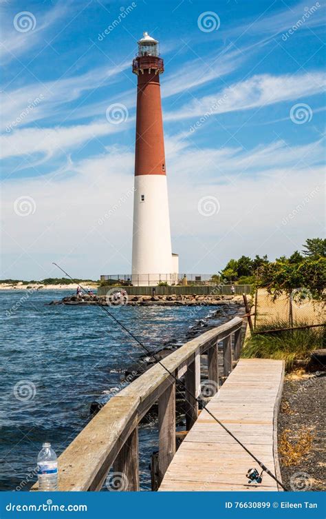 Lighthouse in Long Beach Island Stock Image - Image of beach, fishing ...