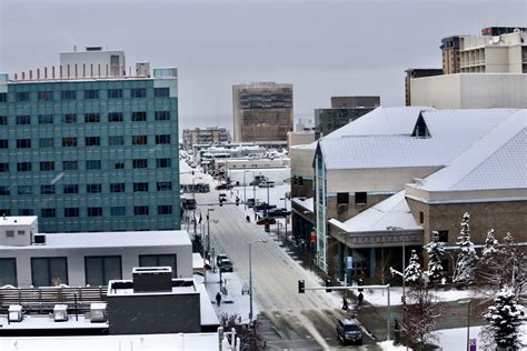 Snow-covered rooftops in downtown Anchorage - Alaska Public Media