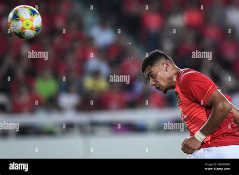 Tyias Browning of China's Guangzhou Evergrande heads the ball against ...