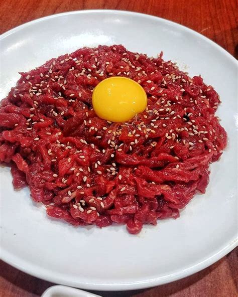 Ever heard of Korean steak tartare? Yukhoe is a Korean marinated raw meat dish with fresh pear ...