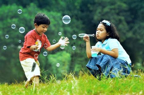 Children Playing With Soap Bubbles Stock Photo - Image of background, blow: 20198538