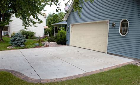 Concrete Driveway with Paver Borders | Driveway design, Concrete driveways, Walkway design