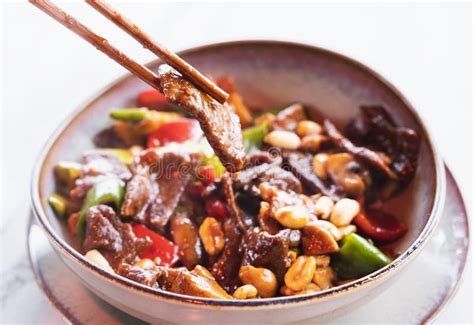 Stir-fried Chinese Dish with Diced Beef, Vegetables, and Peanuts Cooked ...