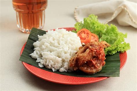 Premium Photo | Close up ayam penyet deep fried chicken served with sambel or sambal spicy ...