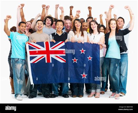 group of people holding New Zealand flag Stock Photo - Alamy