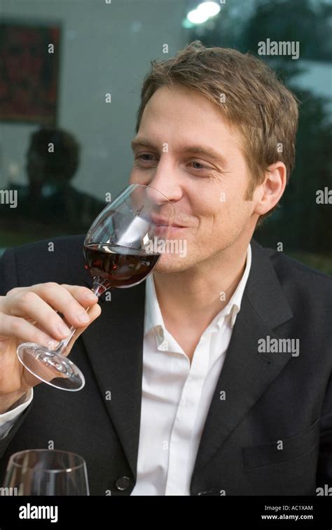 Man drinking red wine Stock Photo - Alamy