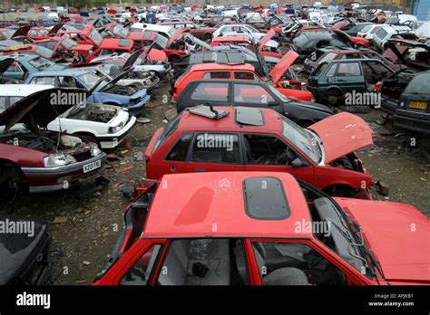 view of scrap cars in UK scrap yard Stock Photo - Alamy