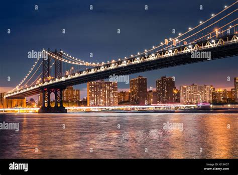 View of Manhattan Bridge from Brooklyn to Manhattan New York City seen lit up at night Stock ...