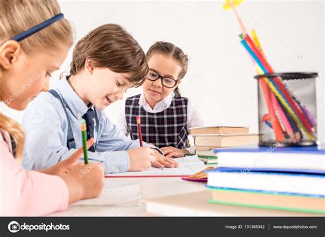 Niños escribiendo en cuadernos: fotografía de stock © AlexNosenko #131368342 | Depositphotos