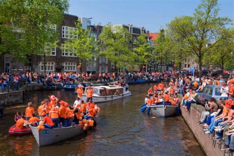 People in Amsterdam celebrate the Queen's Day. People in Amsterdam celebrate the Queen's Day ...