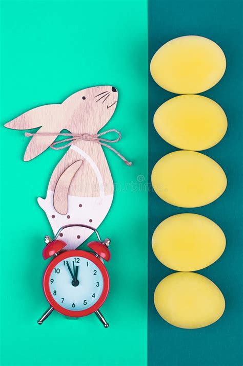 Easter Alarm Clock with Colorful Eggs and Tulips on Yellow Background Stock Image - Image of ...