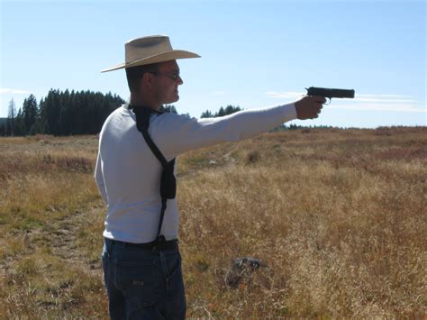 File:Shooting a 1911A1 pistol atop Grand Mesa, Colorado.jpg - Wikimedia Commons