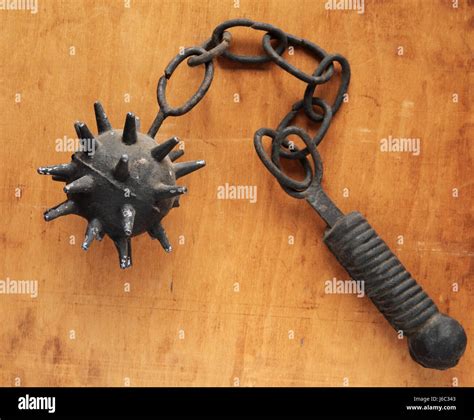 metal archaic association club medieval old arm weapon chain rusty vertical Stock Photo - Alamy