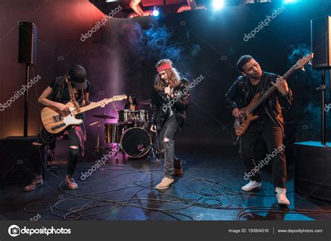 Rock band on stage — Stock Photo © TarasMalyarevich #150804516