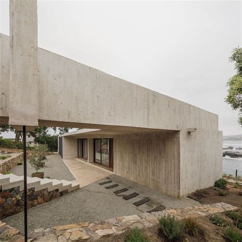 The roof of this concrete house, by @felipeassadi, doubles as a lookout ...