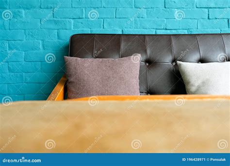 Living Room with Leather Sofa on Blue Brick Wall Stock Image - Image of ...