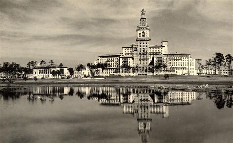 Biltmore Hotel construction with mirror reflection in the lake. Coral ...