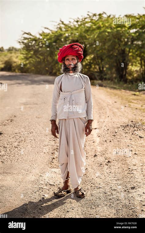 Rajasthani man wearing white traditional dress and red turban Stock ...