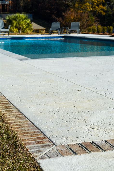 Salt Finish: Concrete Pool Deck + Stone Coping | Stone pool deck, Concrete pool, Pool landscaping