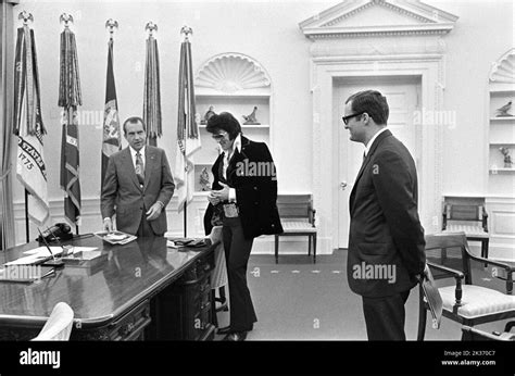 President Richard Nixon meeting Elvis Presley in the White House Oval Office. Assistant Egil ...