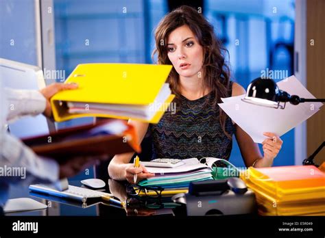 Stressed woman at work Stock Photo - Alamy