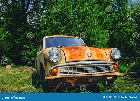 Rusty Old Car among the Green Bushes in Summer. Stock Image - Image of industry, aged: 182511241