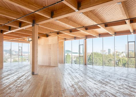 Glass facade reveals timber structure of Portland office building