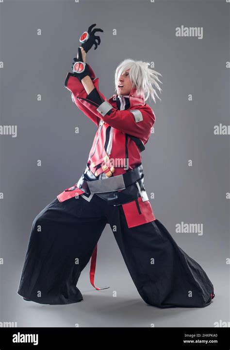 Manga hero with sword. Young man dressed in comic style superhero Stock Photo - Alamy