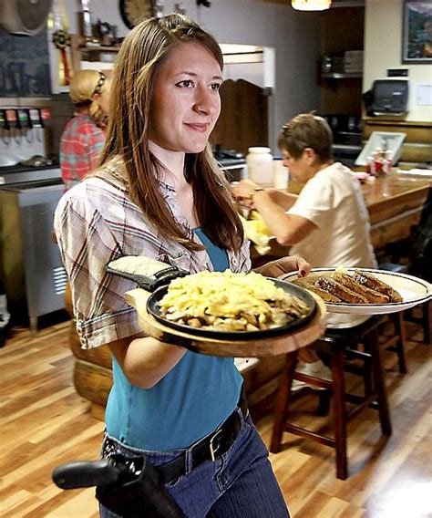 Waitresses wear guns on their hips at Shooters Grill – Twin Cities