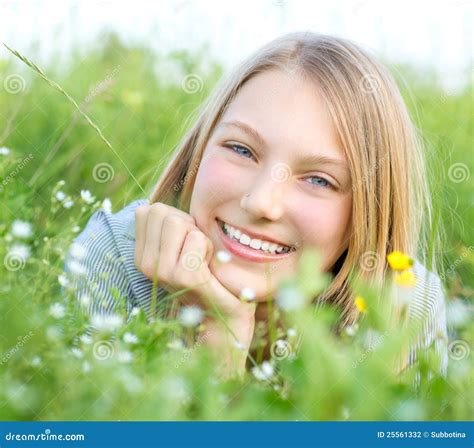 Smiling Girl Relaxing Outdoors Stock Photo - Image of holidays, grass ...