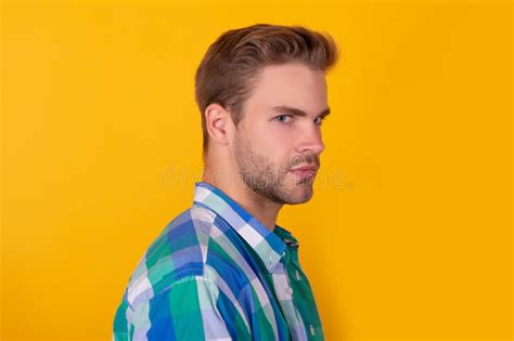 Handsome Unshaven Guy with Serious Face Half Turn Yellow Background, Portrait Stock Image ...