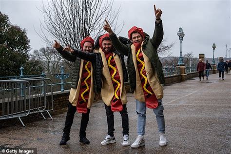 Thousands of boozy darts fans descend on Ally Pally in fancy dress for World Championships ...