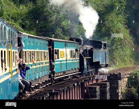 ooty toy train on the way up to ooty narrow gauge steam railway over bridge Stock Photo - Alamy