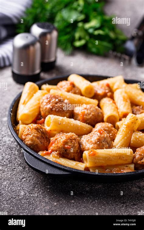 Pasta with meatballs in tomato sauce Stock Photo - Alamy