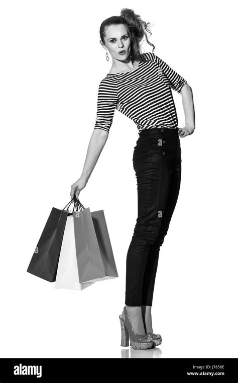 Shopping. The French way. Full length portrait of cheerful trendy woman with shopping bags of ...