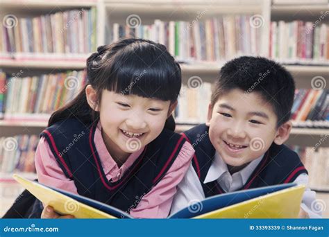 School Children Reading Book a in the Library Stock Image - Image of long, elementary: 33393339