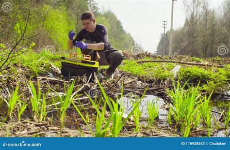 Scientist Ecologist in the Forest Taking Samples of Water Stock Image - Image of conservationist ...