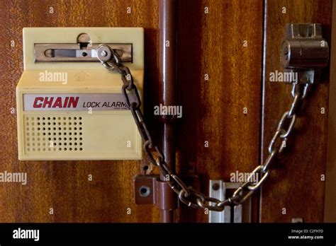 Sliding chain door lock alarm Stock Photo - Alamy