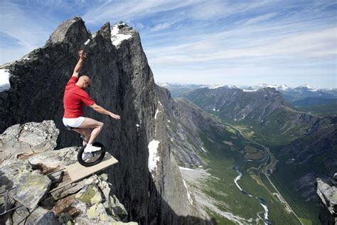 balancing on the edge of 1,000ft cliff in norway photo | One Big Photo