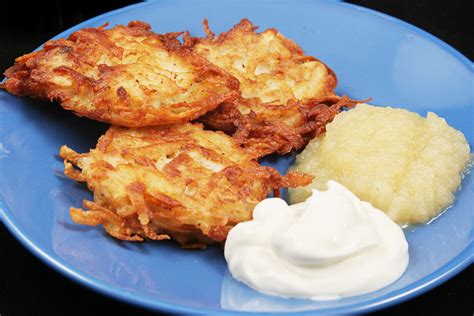 Potato latkes for Hanukkah, served with sour cream and applesauce ...