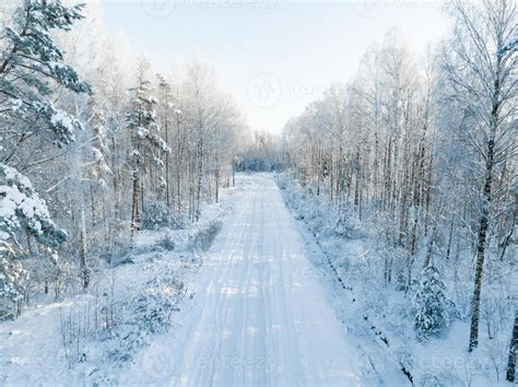 Forest in snow. Snowy forest road. Forest road from above 16276676 Stock Photo at Vecteezy