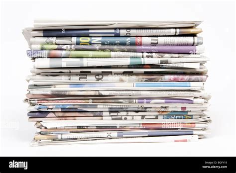 Stack of newspapers on a white background Stock Photo - Alamy