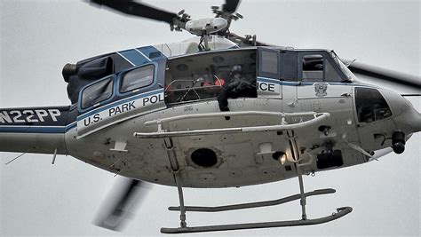 US Park Police With Sharp Shooter On Board Hover Over DC Navy Yard In ...